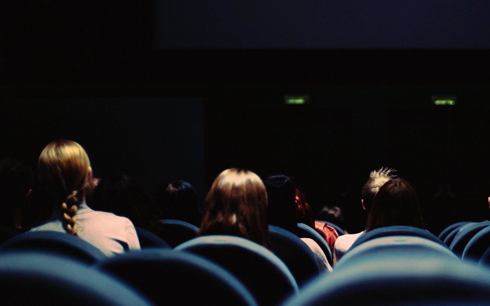 people sitting at movie theater