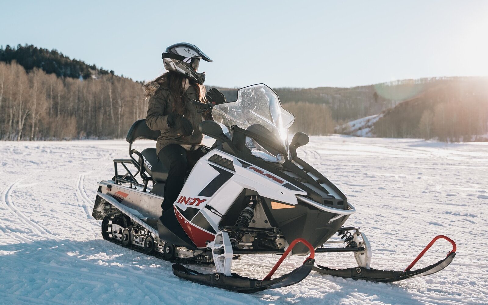 person snowmobiling